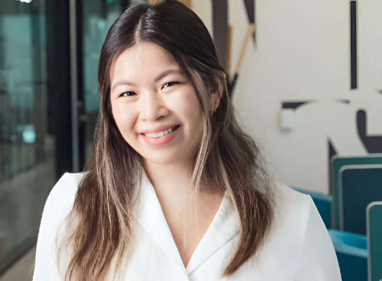 A psychologist smiles at the camera.